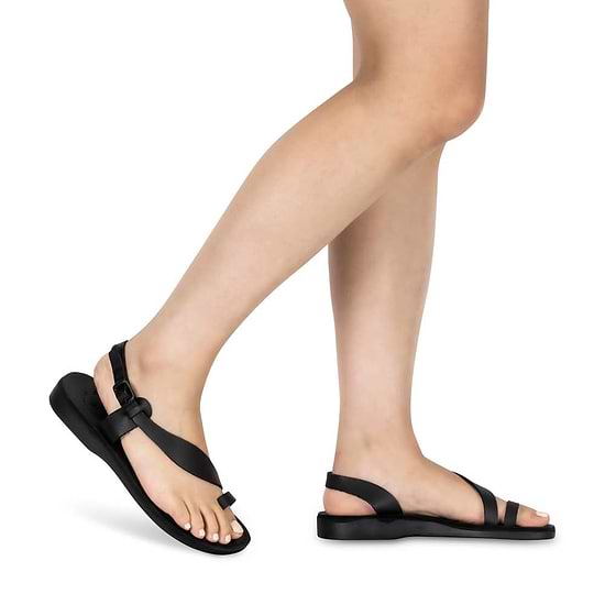 Model wearing Mia black, handmade leather sandals with back strap and toe loop