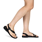 Model wearing Mia black, handmade leather sandals with back strap and toe loop