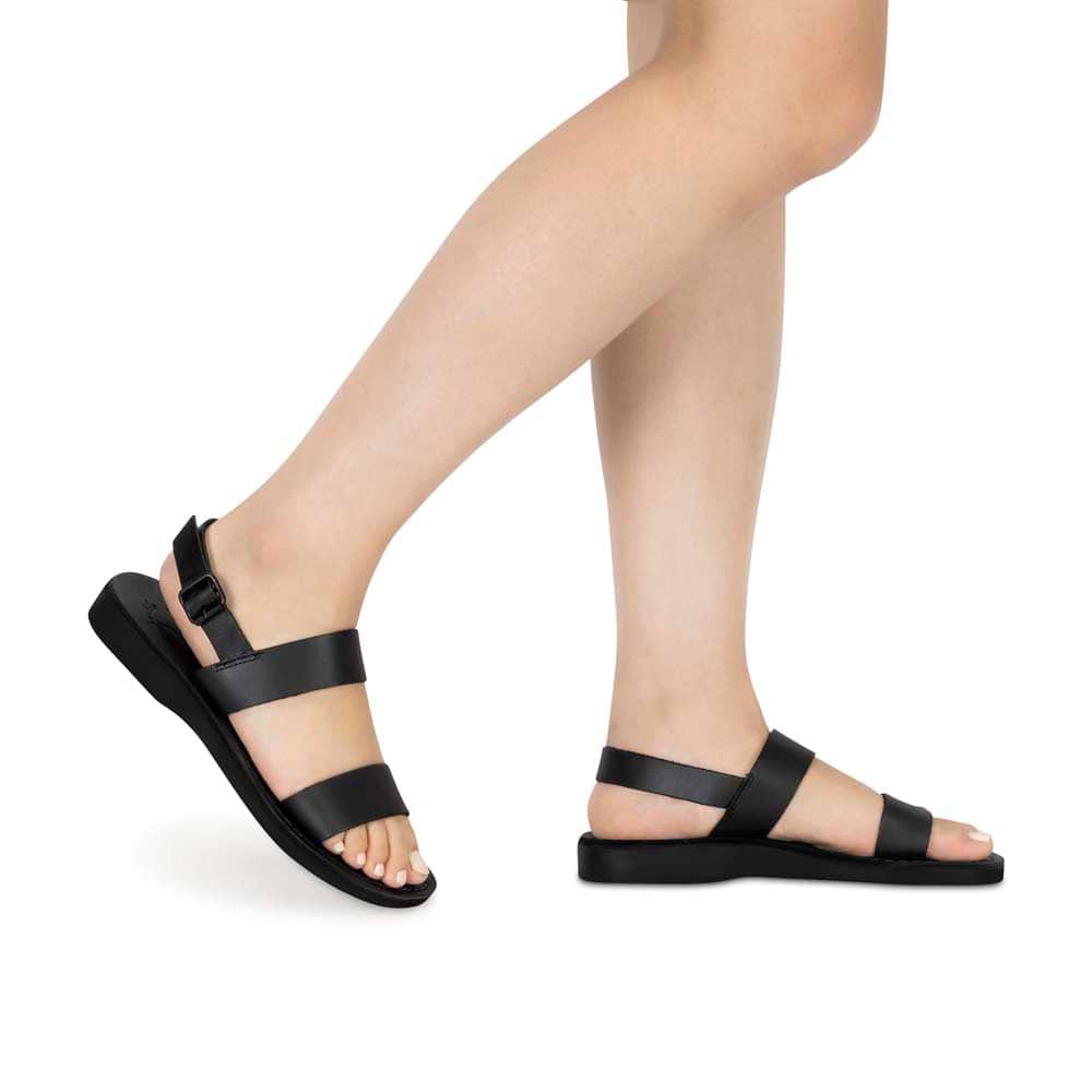 Model wearing Golan black, handmade leather sandals with back strap
