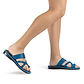 Model wearing The Good Shepherd Blue, handmade leather slide sandals with toe loop