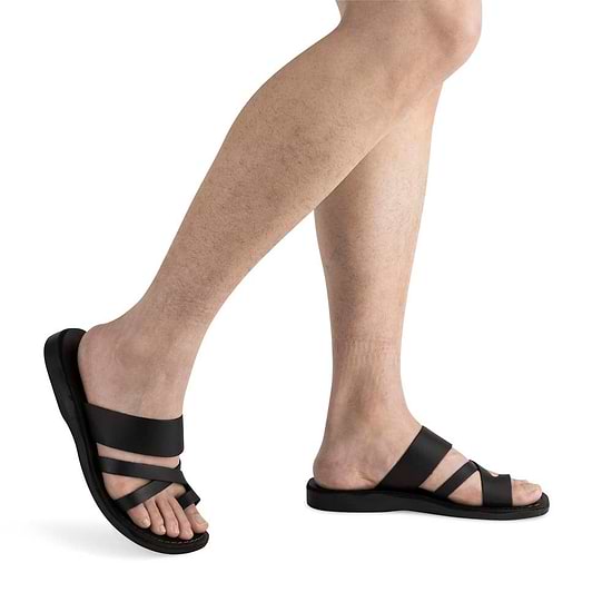 Male Model wearing The Good Shepherd black, handmade leather slide sandals with toe loop
