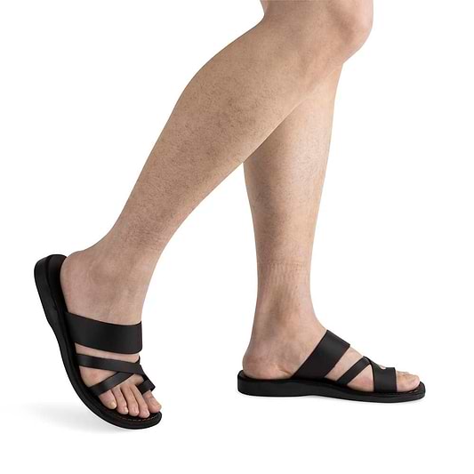 Male Model wearing The Good Shepherd black, handmade leather slide sandals with toe loop