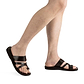 Model wearing The Good Shepherd brown, handmade leather slide sandals with toe loop