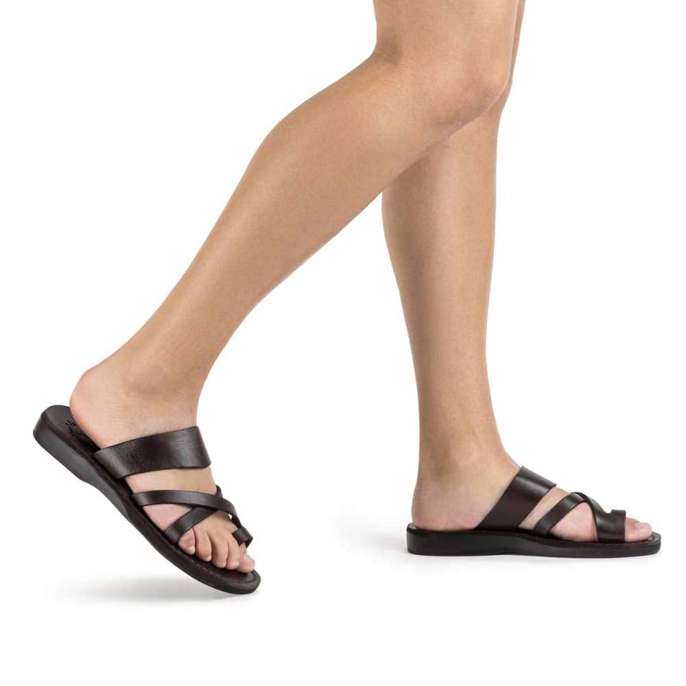 Model wearing The Good Shepherd brown, handmade leather slide sandals with toe loop