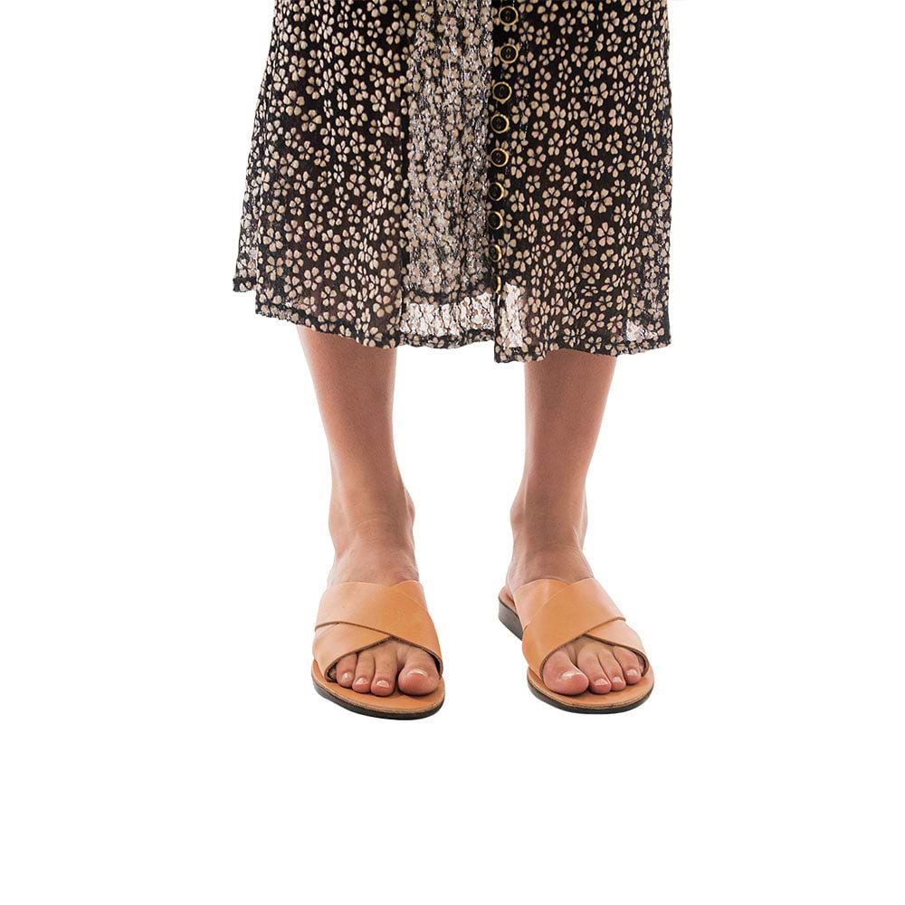 Model wearing Isla tan, handmade leather slide sandals