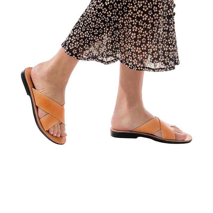 Model wearing Isla tan, handmade leather slide sandals