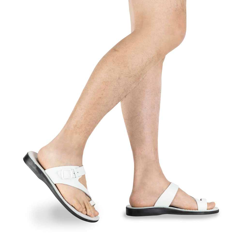 Model wearing Abner White, handmade leather slide sandals with toe loop - Side View