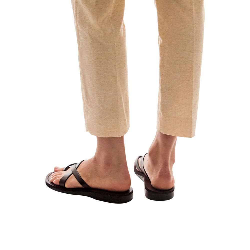 Model wearing Abigail brown, handmade leather slide sandals with toe loop