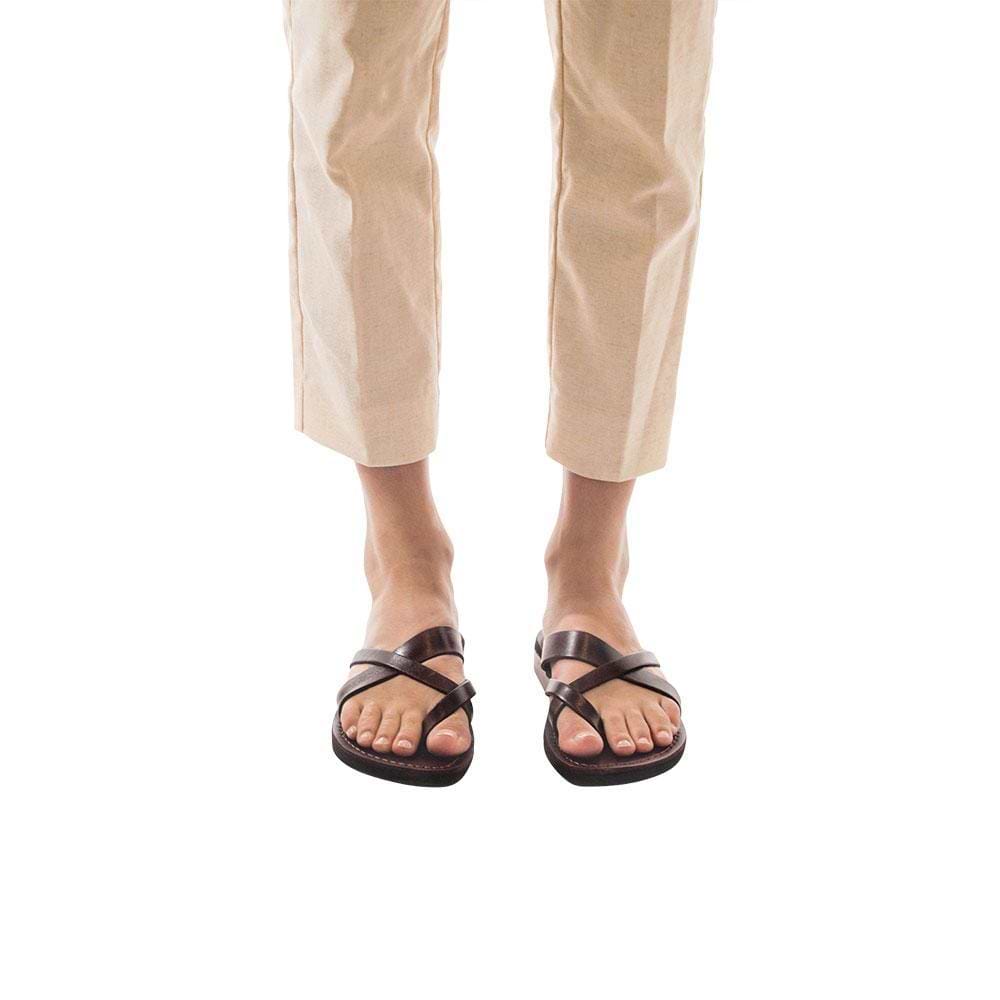 Model wearing Abigail brown, handmade leather slide sandals with toe loop