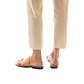 Model wearing Abra tan, handmade leather slide sandals with toe loop 