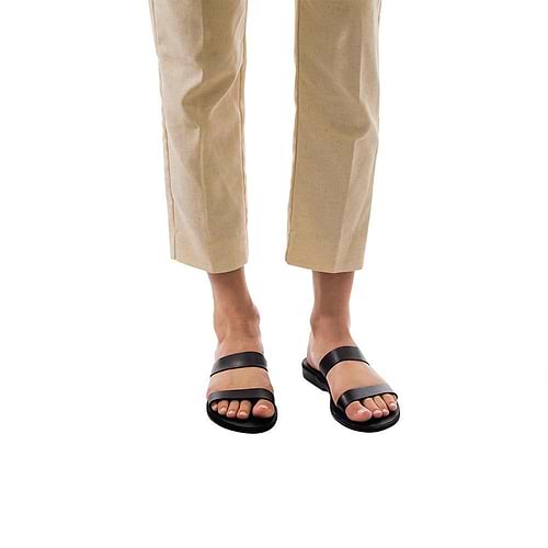 Model wearing Ada black, handmade leather slide sandals 