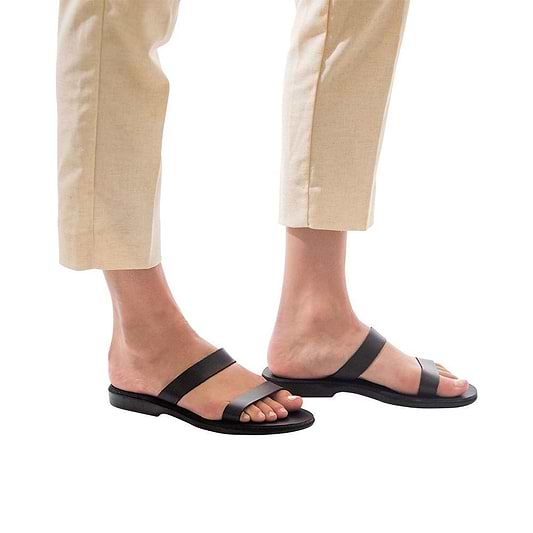 Model wearing Ada black, handmade leather slide sandals 