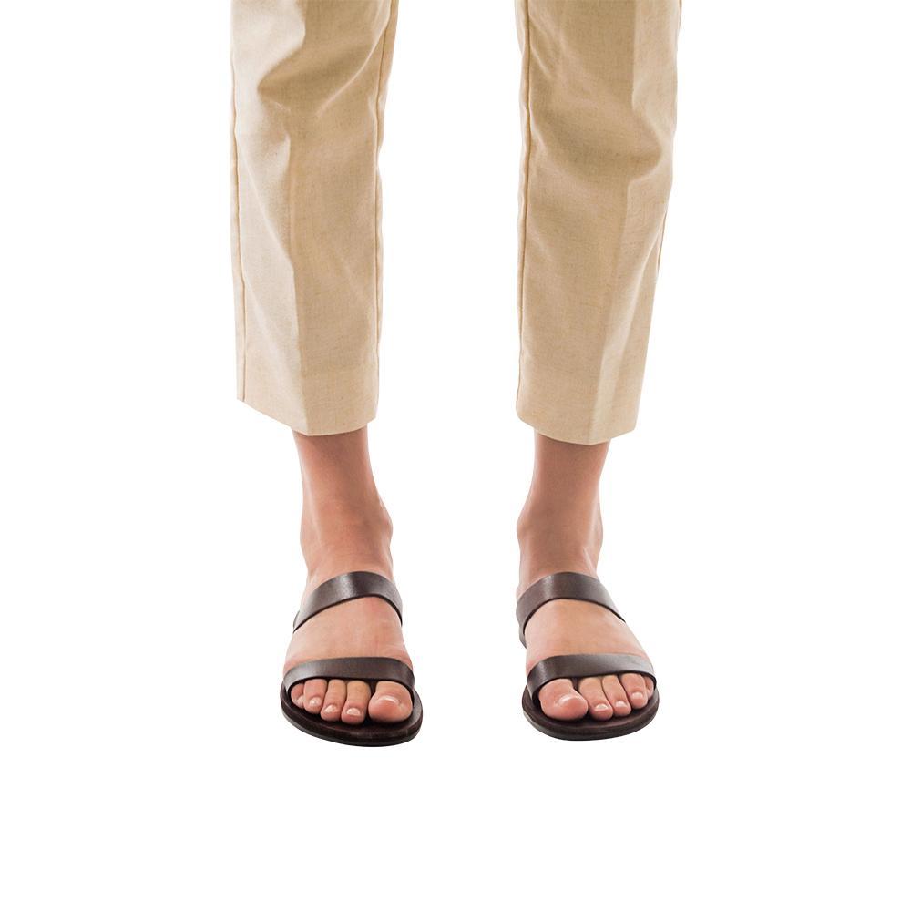 Model wearing Ada brown, handmade leather slide sandals 