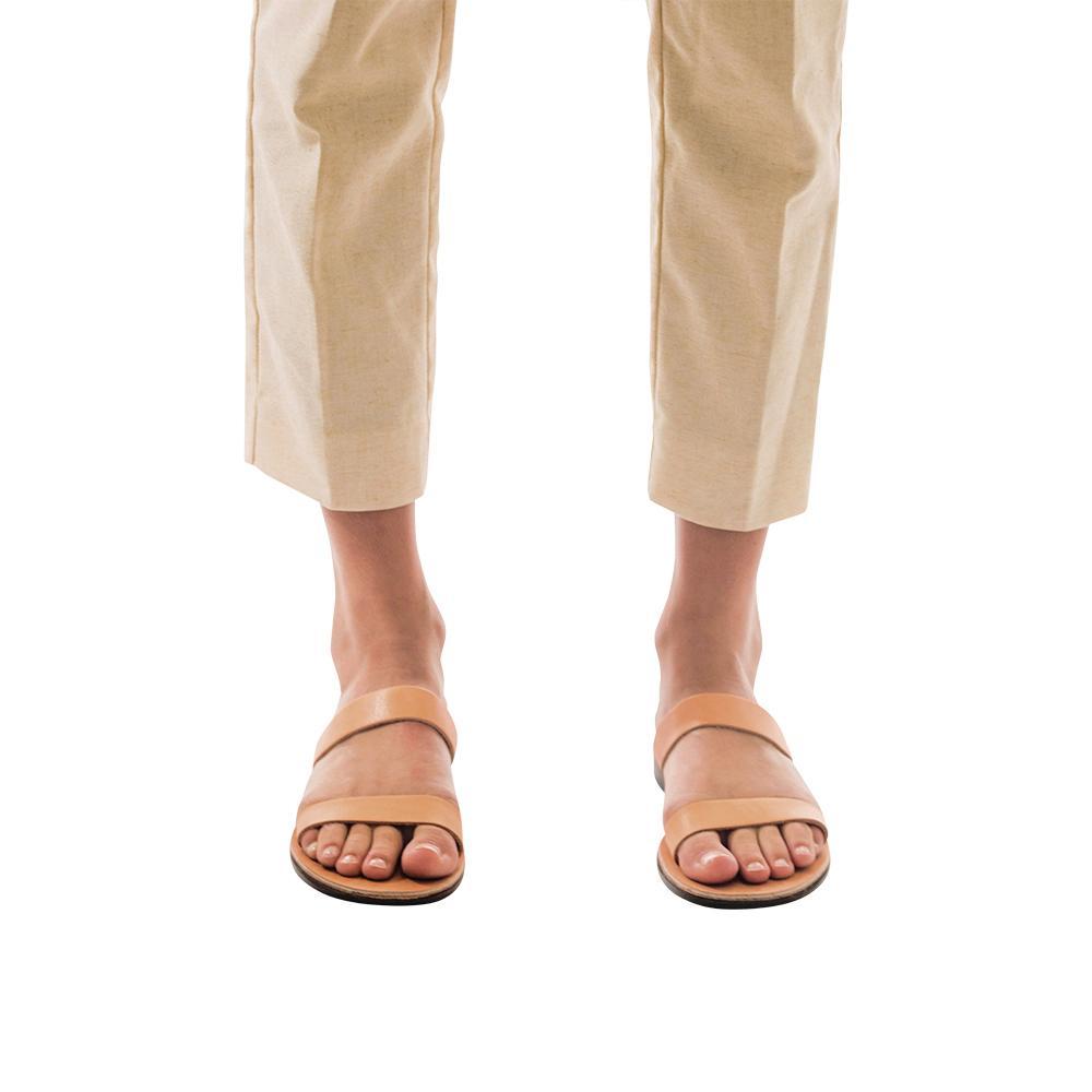 Model wearing Ada tan, handmade leather slide sandals 