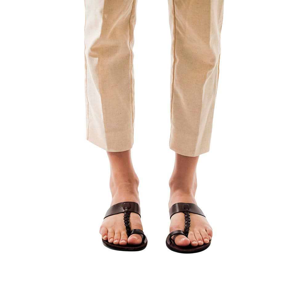 Model wearing Ara brown, handmade leather slide sandals with toe loop 
