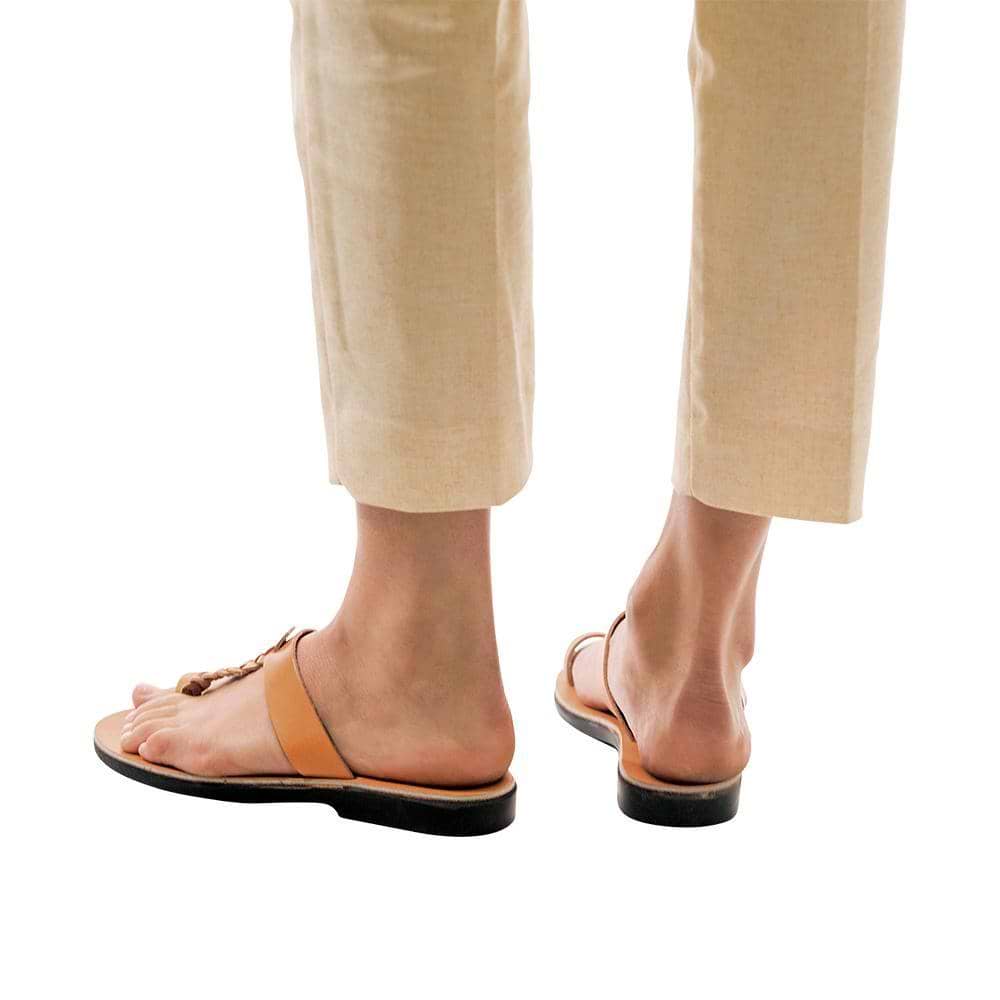 Model wearing Ara tan, handmade leather slide sandals with toe loop 