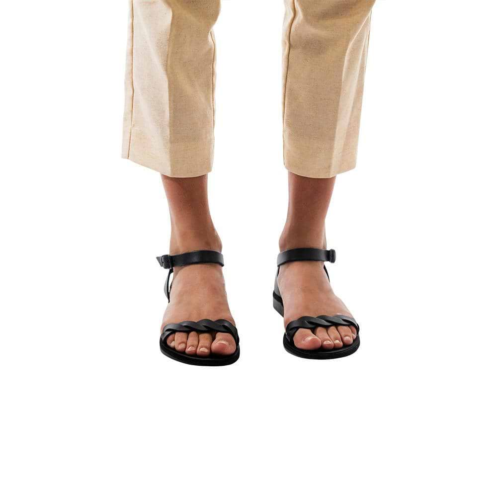 Model wearing Arden black, handmade leather sandals with back strap  
