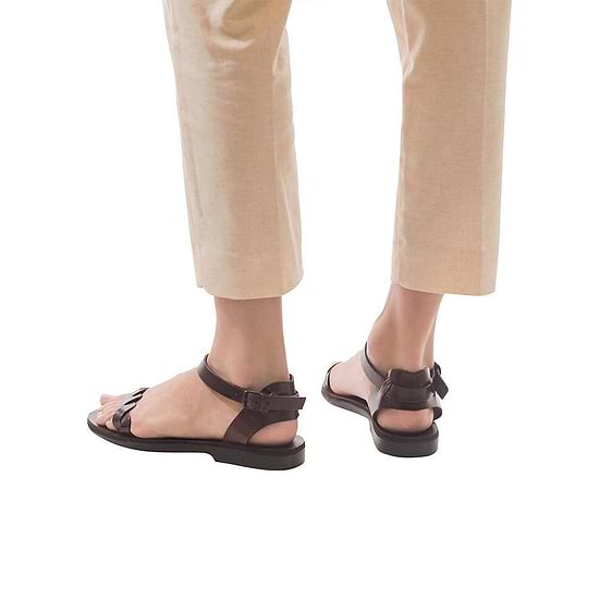 Model wearing Arden brown, handmade leather sandals with back strap  