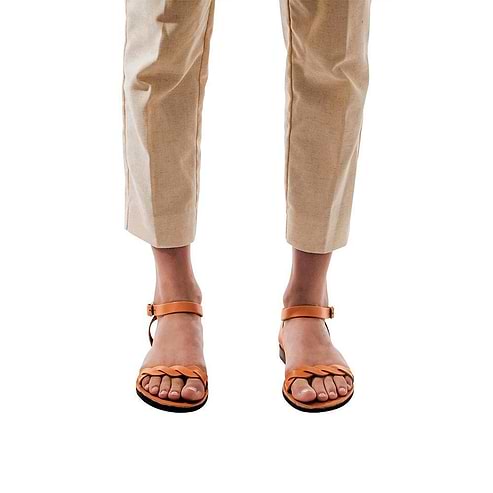 Model wearing Arden tan, handmade leather sandals with back strap  