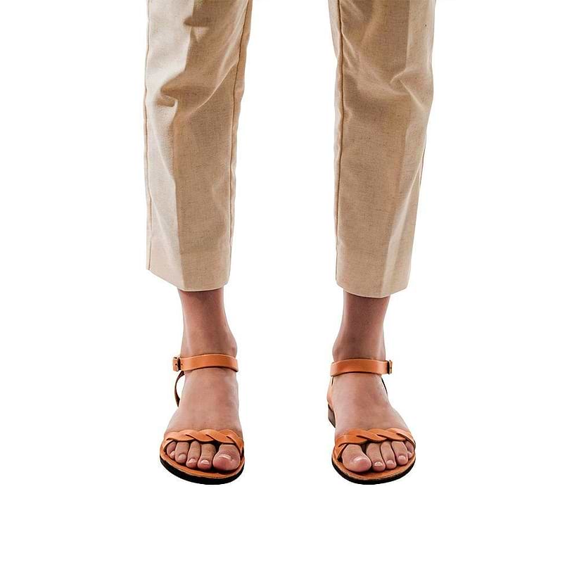 Model wearing Arden tan, handmade leather sandals with back strap  