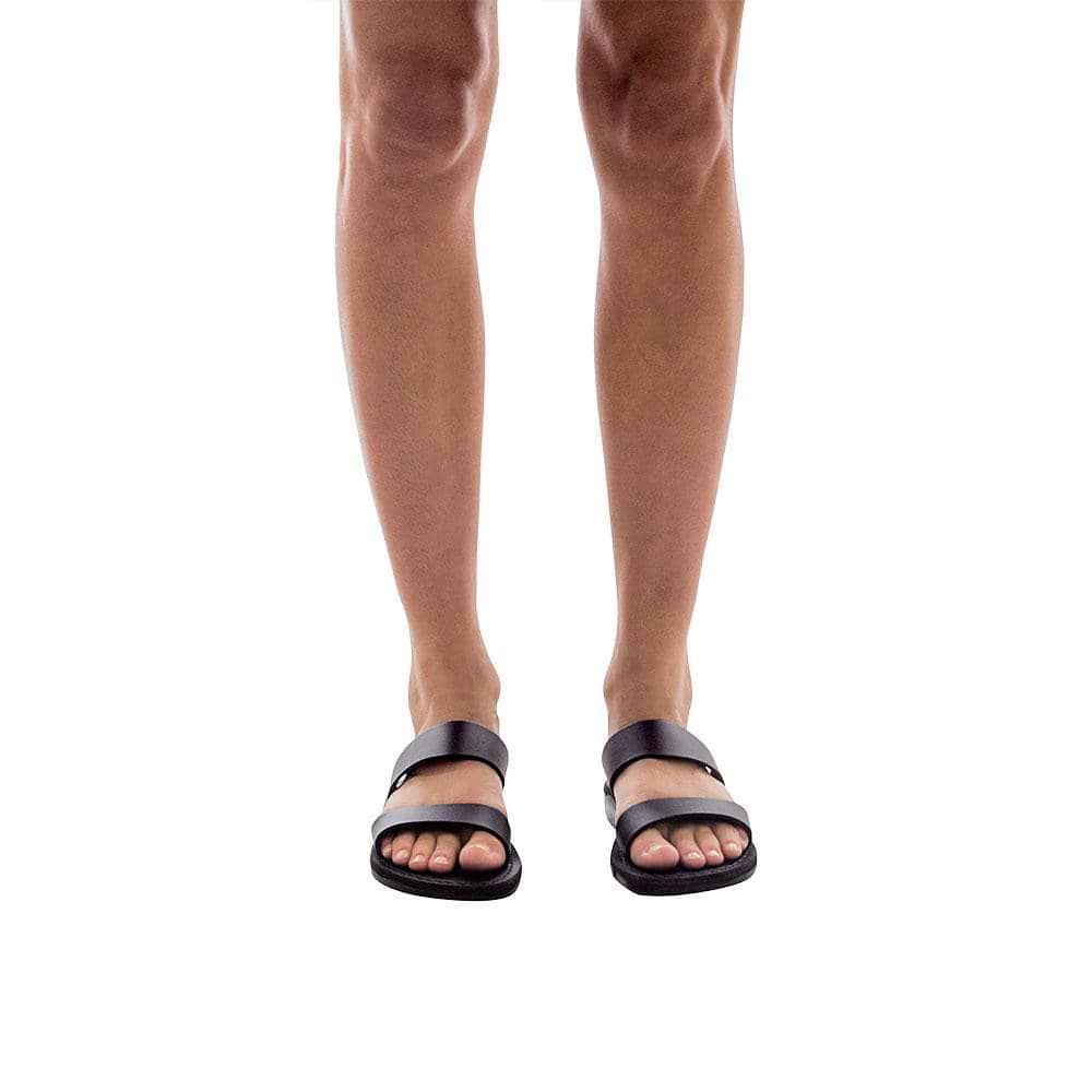 Model wearing Aviv black, handmade leather slide sandals 