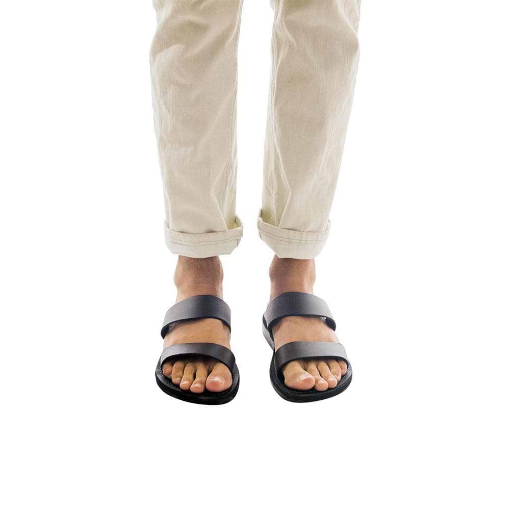 Model wearing Aviv black, handmade leather slide sandals 