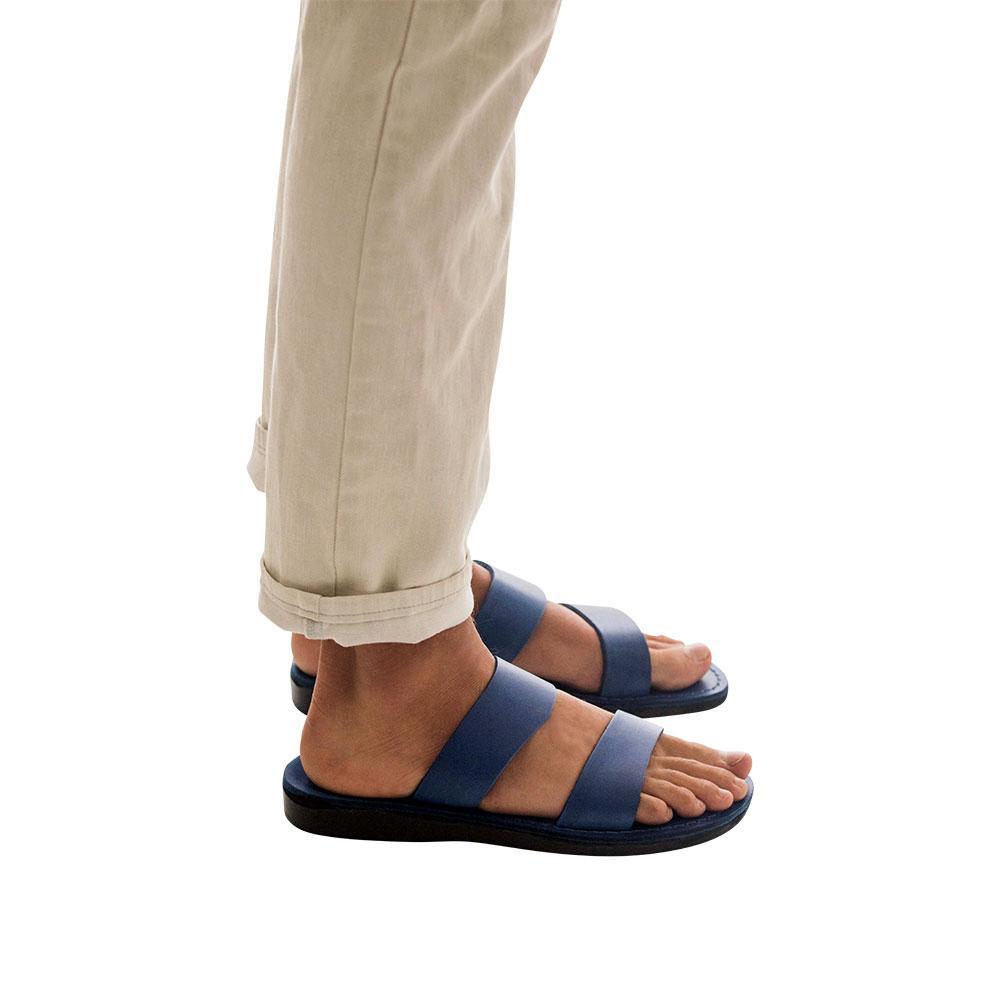 Model wearing Aviv blue, handmade leather slide sandals 