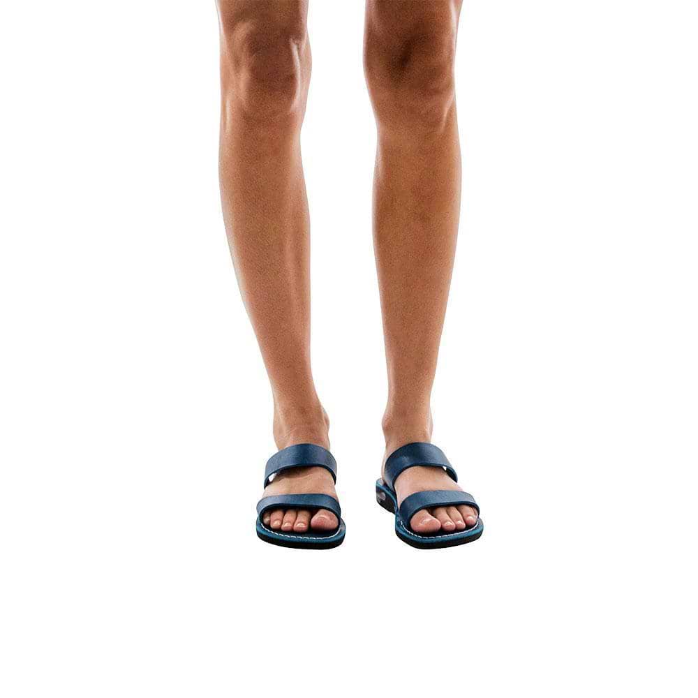 Model wearing Aviv blue, handmade leather slide sandals 