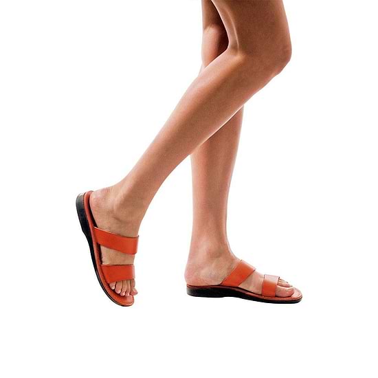 Model wearing Aviv orange, handmade leather slide sandals 