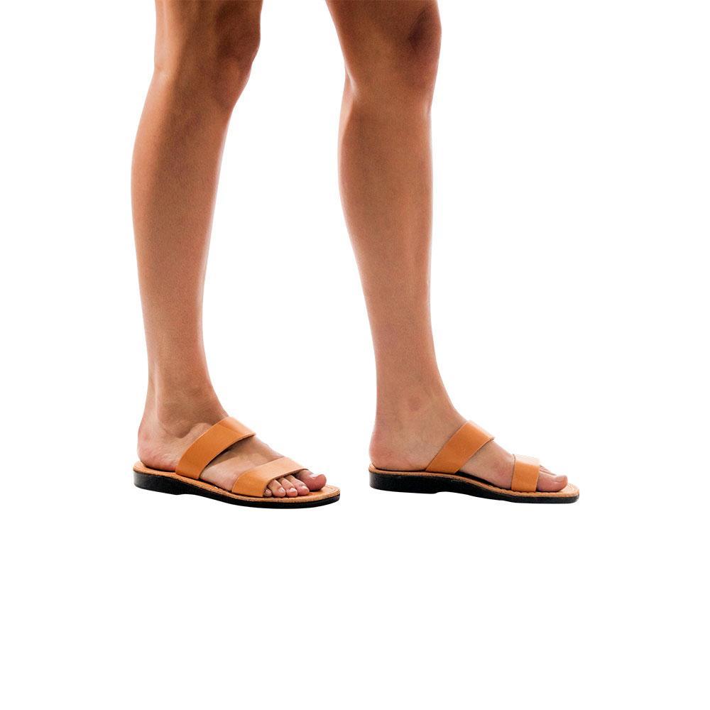 Model wearing Aviv tan, handmade leather slide sandals 