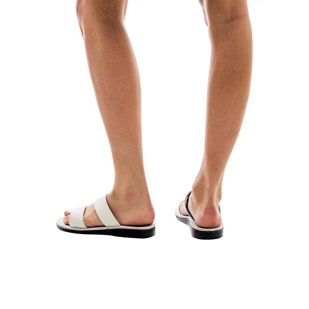 Model wearing Aviv white, handmade leather slide sandals 