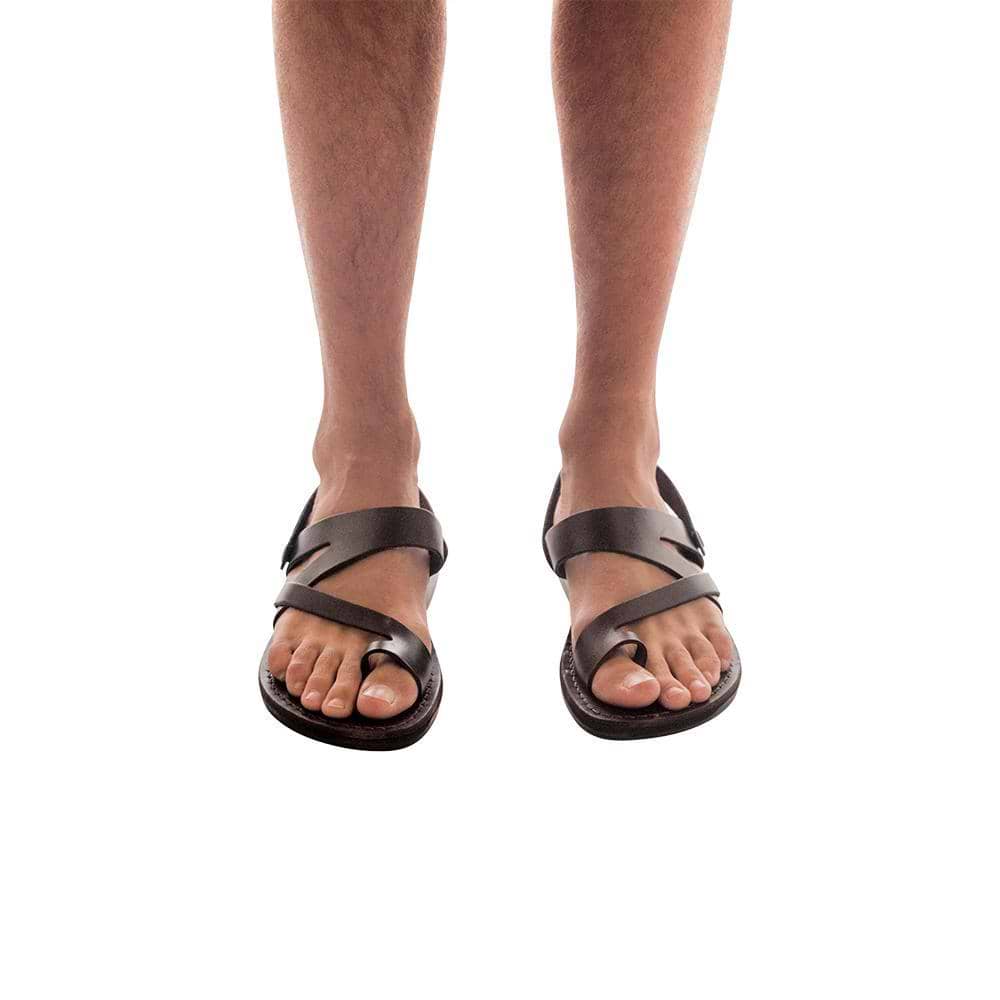 Model wearing Benjamin brown, handmade leather sandals with back strap and toe loop 