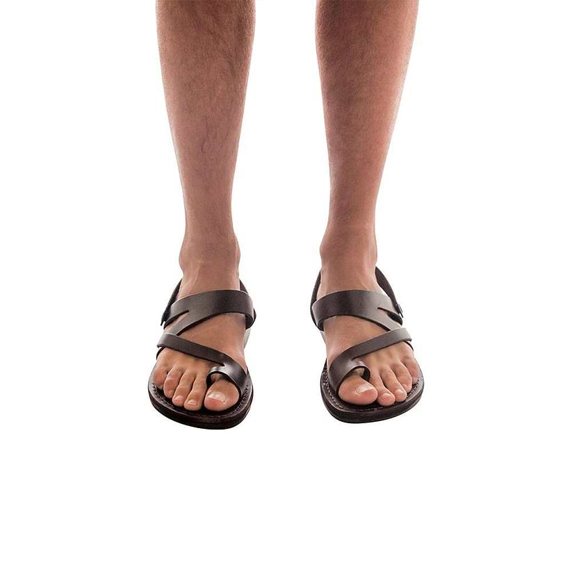 Model wearing Benjamin brown, handmade leather sandals with back strap and toe loop 