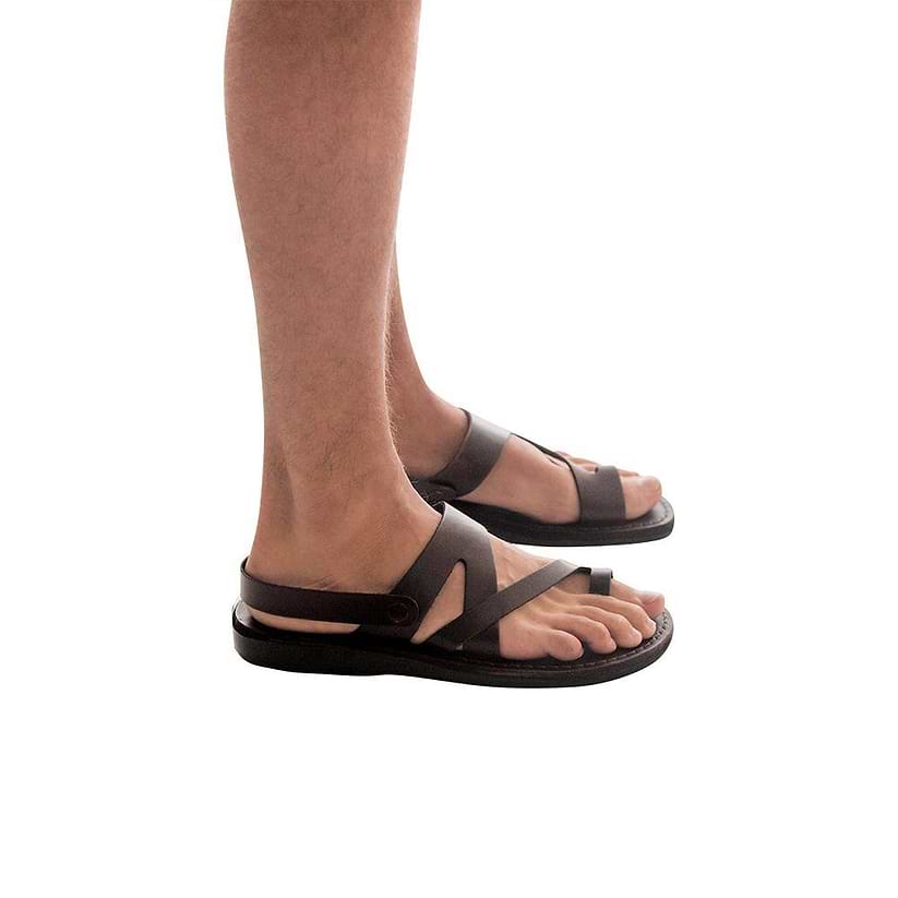 Model wearing Benjamin brown, handmade leather sandals with back strap and toe loop 