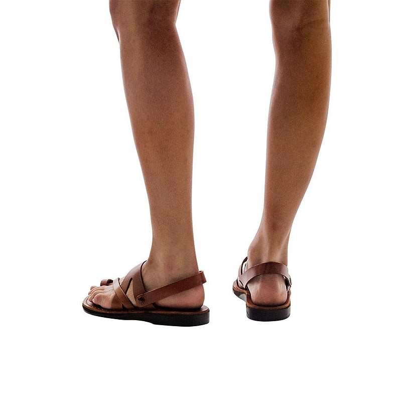 Model wearing Benjamin honey, handmade leather sandals with back strap and toe loop  
