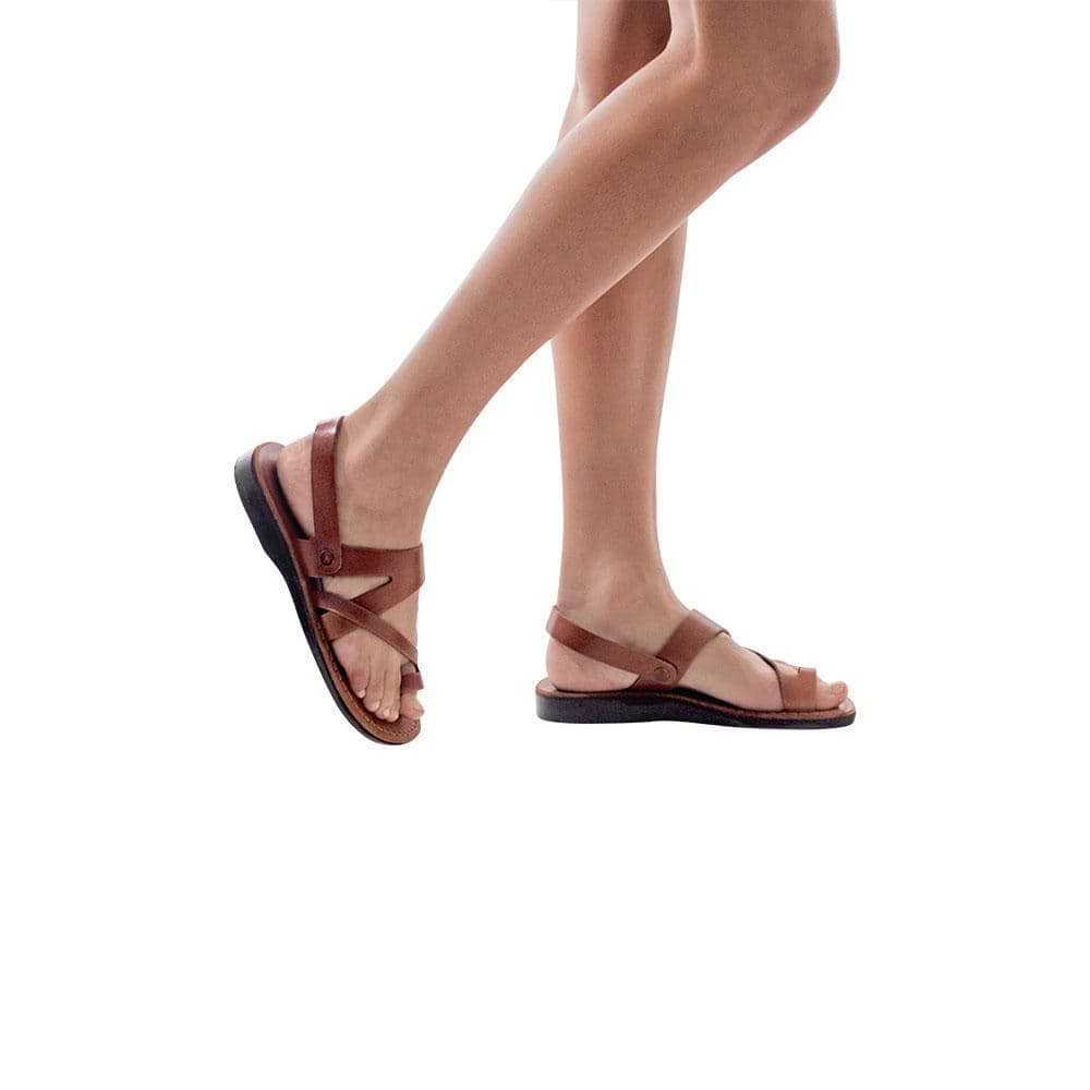 Model wearing Benjamin honey, handmade leather sandals with back strap and toe loop