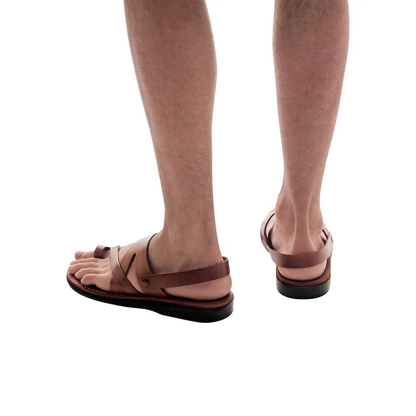 Model wearing Benjamin honey, handmade leather sandals with back strap and toe loop 