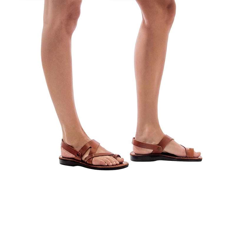 Model wearing Benjamin honey, handmade leather sandals with back strap and toe loop  