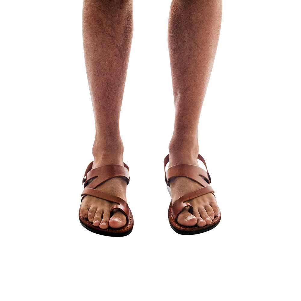 Model wearing Benjamin honey, handmade leather sandals with back strap and toe loop 