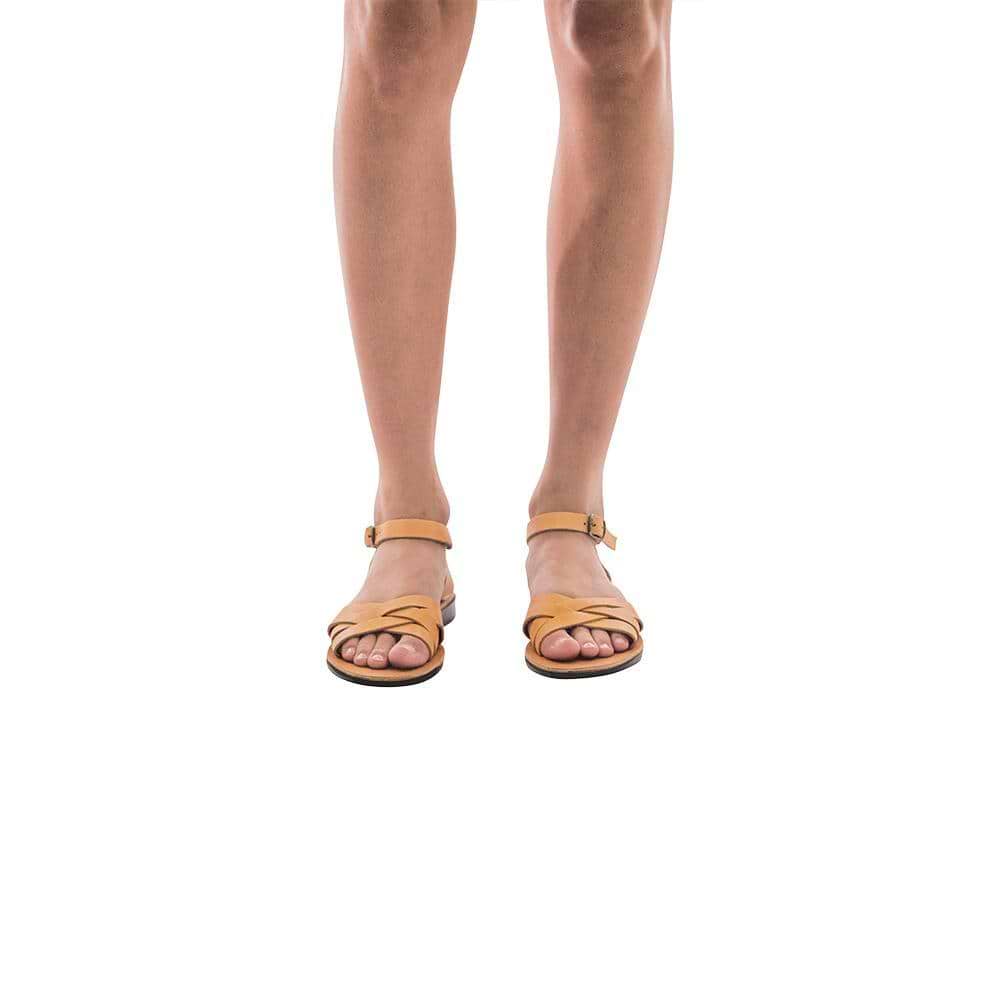 Model wearing Chloe tan, handmade leather sandals with back strap