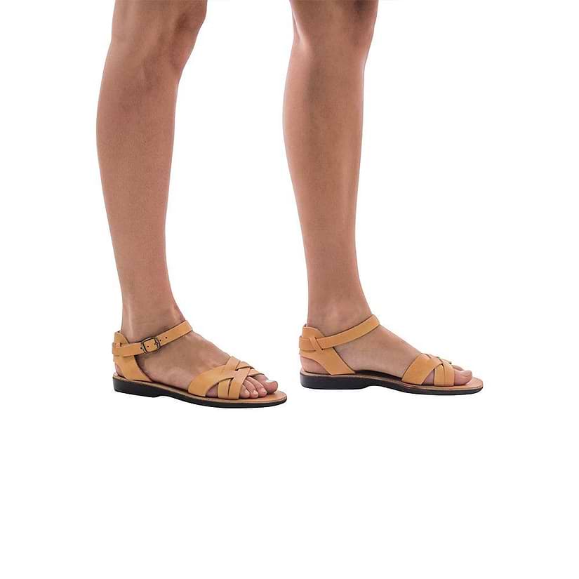 Model wearing Chloe tan, handmade leather sandals with back strap