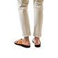 Model wearing Elan black-tan, handmade leather slide sandals back view