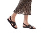 Model wearing Elan Buckle black, handmade leather sandals with back strap - Front View