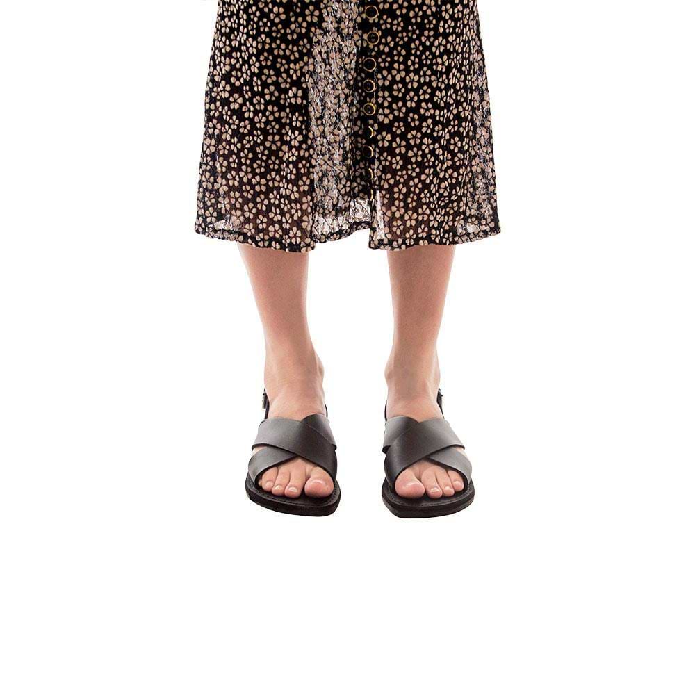Model wearing Elan Buckle black, handmade leather sandals with back strap - Front View