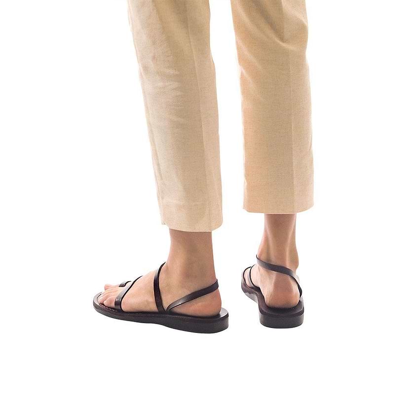 Model wearing Ella brown, handmade leather sandals with back strap and toe loop  