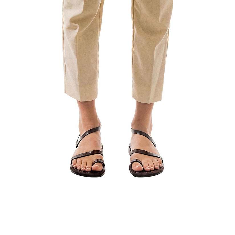 Model wearing Ella brown, handmade leather sandals with back strap and toe loop  