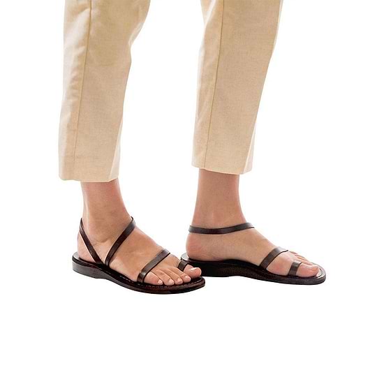 Model wearing Ella brown, handmade leather sandals with back strap and toe loop  