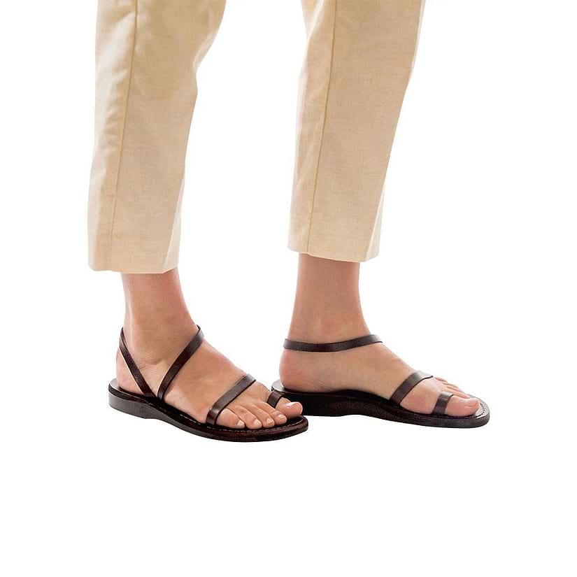 Model wearing Ella brown, handmade leather sandals with back strap and toe loop  