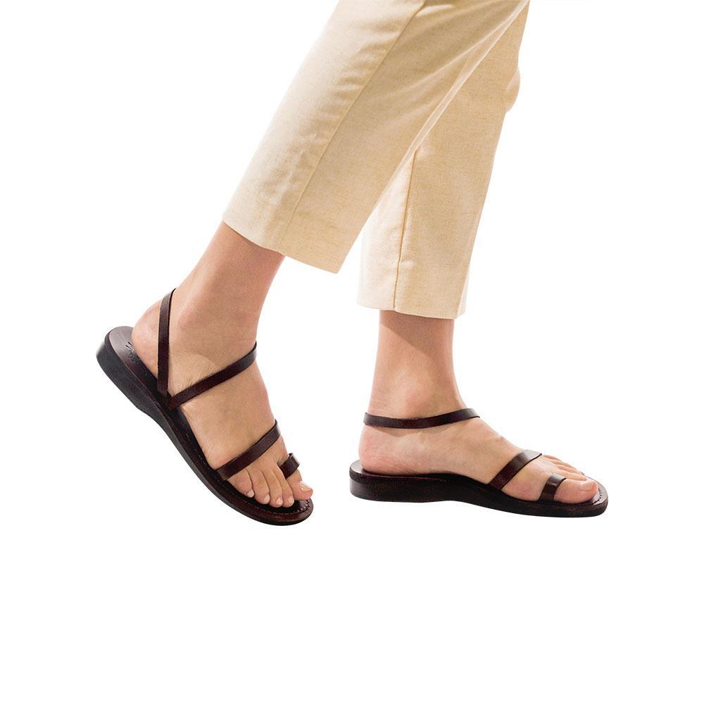 Model wearing Ella brown, handmade leather sandals with back strap and toe loop  
