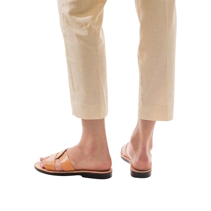 Model wearing Emily tan, handmade leather slide sandals